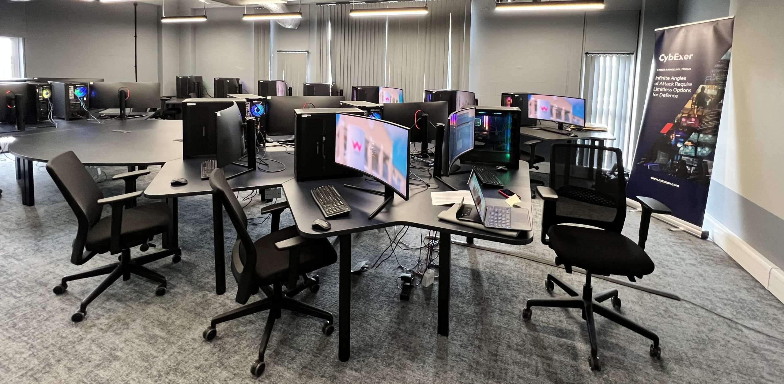 IT room with computers and screens
